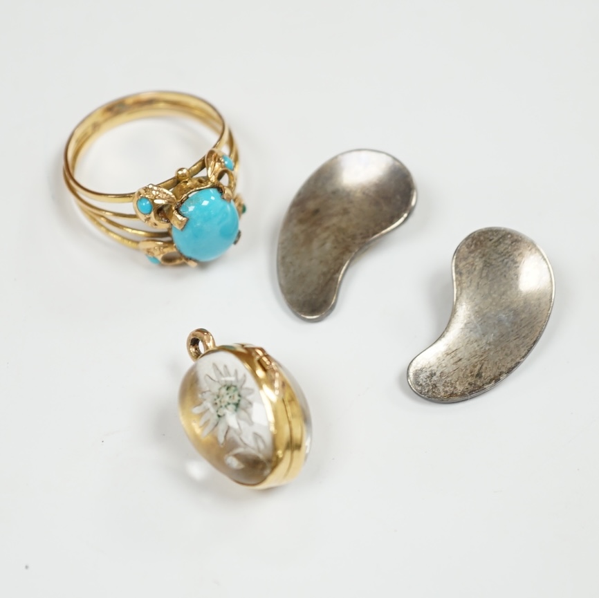 A Middle Eastern yellow metal and turquoise cluster set ring, size P/Q, together with a yellow metal and Essex crystal style egg shaped pendant, depicting a flower and a pair of Georg Jensen sterling ear clips, design no